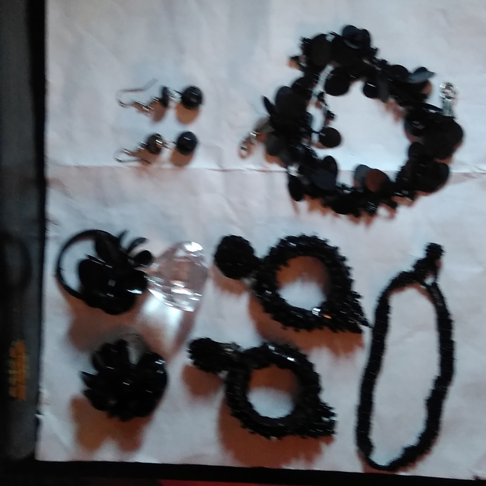 2 sets of earrings one key holder two bracelets and one ring